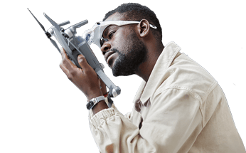 A drone engineer repairing an uncrewed aerial system.