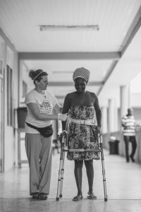 Operation Walk Physical Therapist helping Patient after Joint Replacement in Ghana