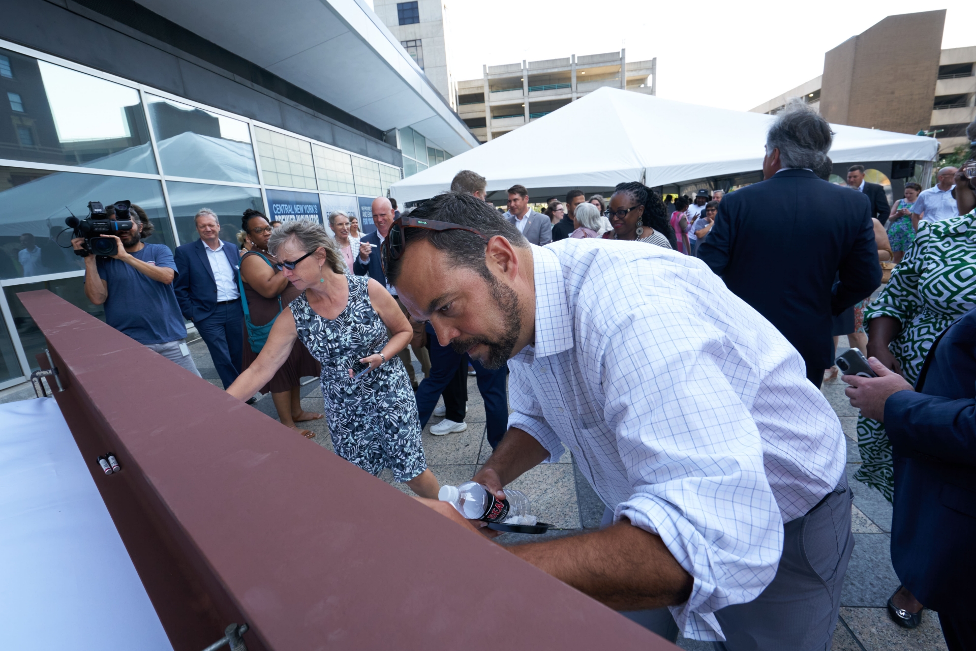 CenterState CEO's Dominic Robinson and Lori Dietz sign a steel beam at The Tech Garden Expansion Kickoff.